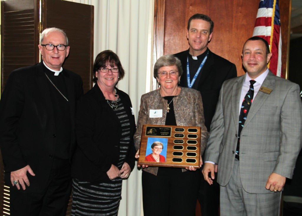 Bishop Noonan, Mrs. Del Rey, Dr. Curran, Fr. Parkes and Superintendent Henry Fortier
